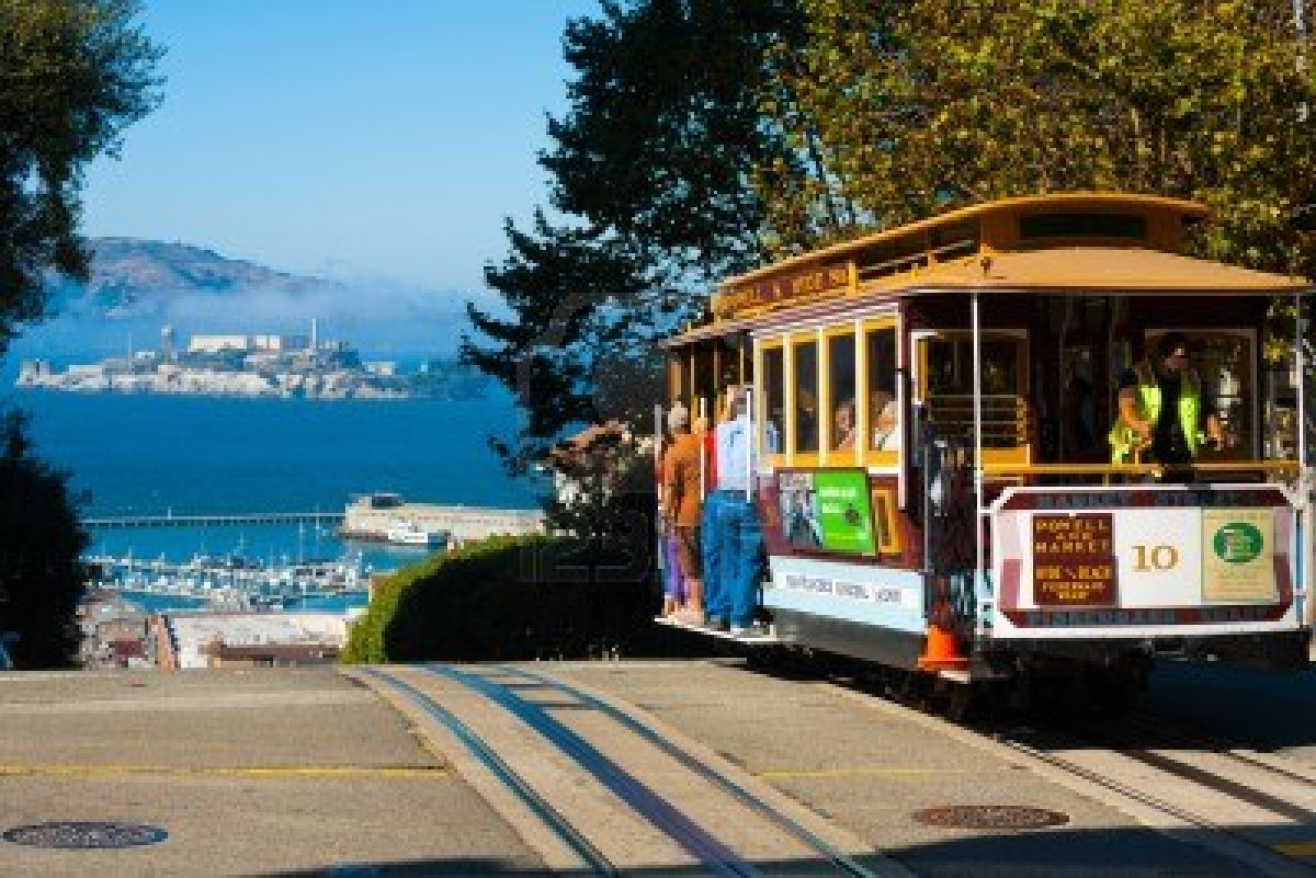 14681941-san-francisco-usa--september-21-2011-powell-hyde-cable-car-an-iconic-tourist-attraction-descends-a-s.jpg