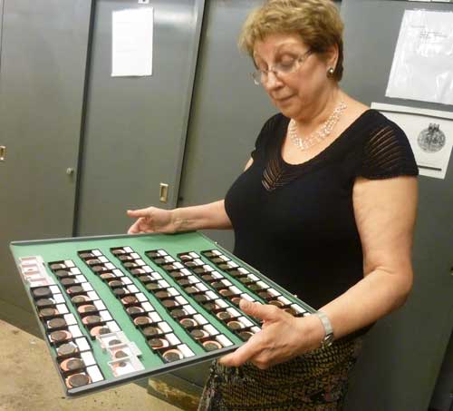 Elena Stolyarik, collections manager of the American Numismatic Society, with a tray of coins reclaimed from the Hispanic Society of America's disposalPhoto by Lee Rosenbaum