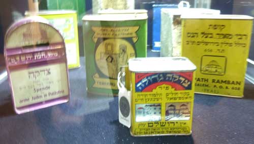 From a group of 11 tin tzedakah (charity) boxes, 20th century (est. for set: $3,000-4,000)