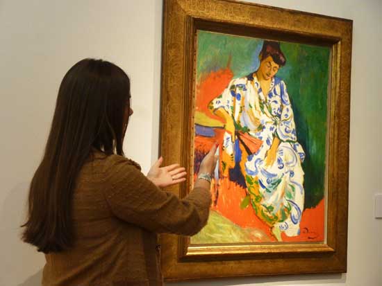 Brooke Lampley extolling virtues of Derain's "Madame Matisse" at Christie's press preview Photo by Lee Rosenbaum