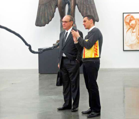 Massimiliano Gioni (right) discussing Dakis Joannou show with a visitor at the New Museum Photo by Lee Rosenbaum