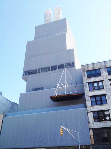 Chris Burden's "Ghost Ship," 2005, and "Twin Quasi Legal Skyscrapers," 2013, on the façade and roof of the New Museum Photo by Lee Rosenbaum