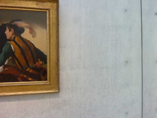 Vertical streaks and mottling on concrete wall to right of Caravaggio's "The Cardsharps." Photo by Lee Rosenbaum