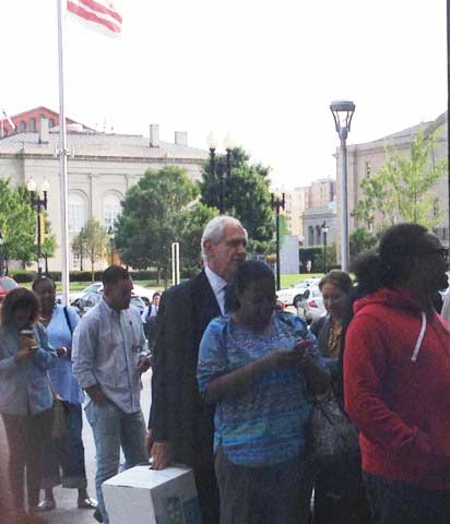 Charles Patrizia (holding white file box), waiting to go through metal detectors at D.C. Superior Court Photo by Lee Rosenbaum