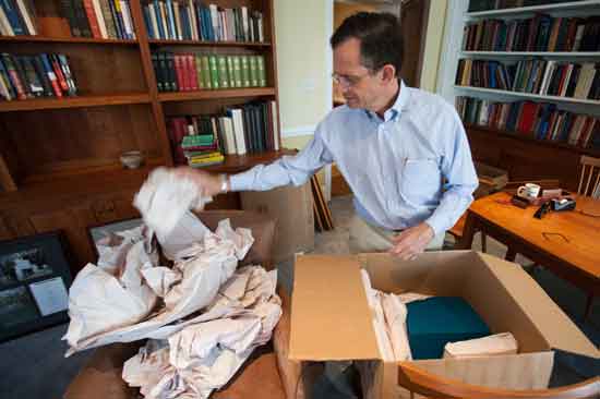 Time to pack up again? Dan Weiss unpacking cartons in his then new Haverford office, July 2013