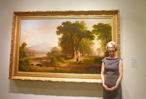 Carmine Branagan, director of the National Academy, posing in 2011 in front of Asher B. Durand’s “The Morning of Life,” 1840 Photo by Lee Rosenbaum
