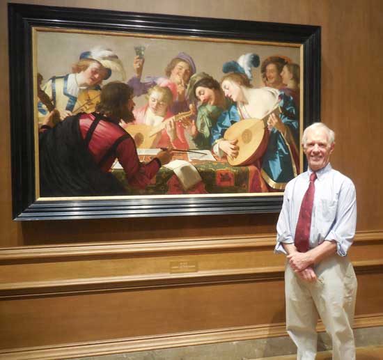 Arthur Wheelock Jr., curator of Northern Baroque painting, with Gerrit van Honthorst's "The Concert," 1623