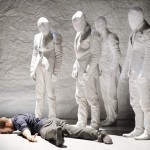 Prospero (Eric Beauchesne) regarded by some of the "replicas" at the end of Kidd Pivot's The Tempest Replica by Crystal Pite. Photo: Geörg Baumann