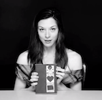 Stoya shows the cover of Necrophilia Variations.