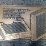 One of the 96 plaques of Library Walk designed by Greenwich Village sculptor Gregg Lefevre.