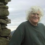 Greg Sandow by a cairn in England