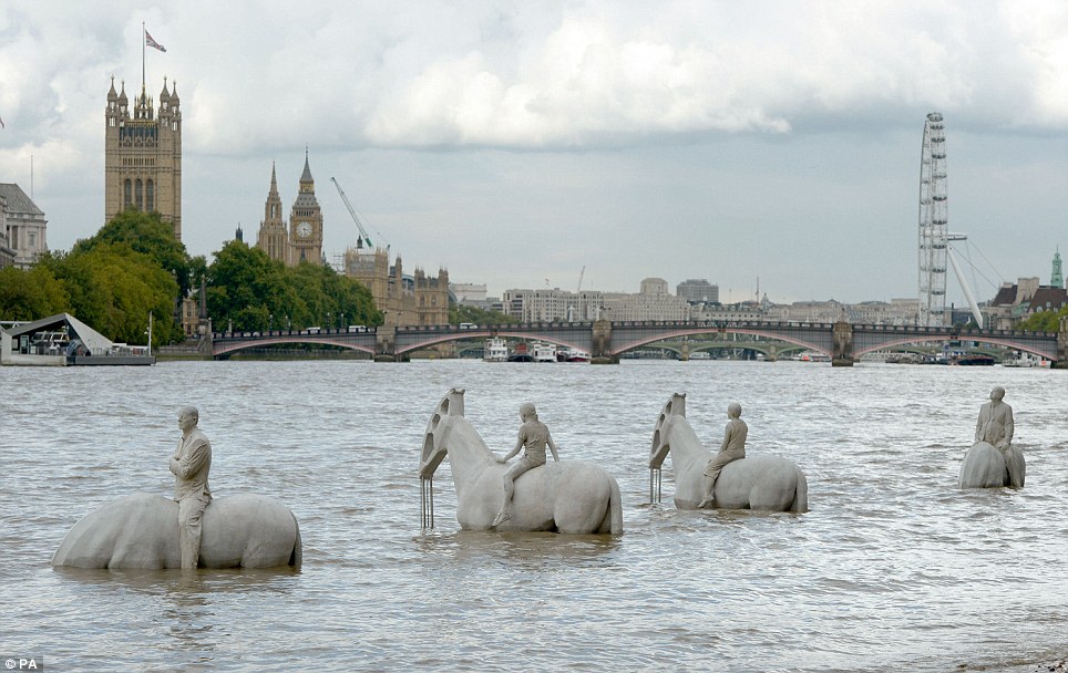 The four horseman by Jason deCaires Taylor wait to drown in the Thames with global warming