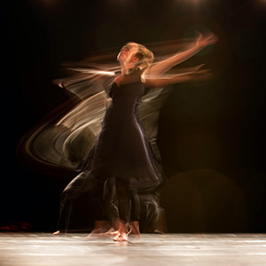 Blurred image of a dancer in motion.