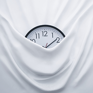 Photo of a clock wrapped in fabric.