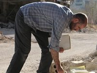 Scavenging For A Library From The Ruins Amidst Syria’s Civil War