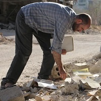 Scavenging For A Library From The Ruins Amidst Syria’s Civil War