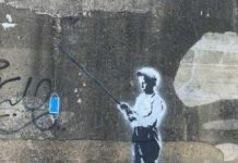In 2014 A Town Painted Over A Banksy. This Time It Placed Guards To Protect A New One