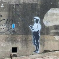 In 2014 A Town Painted Over A Banksy. This Time It Placed Guards To Protect A New One