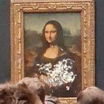 This Guy Dressed Up As An Old Lady, Rolled His Wheelchair Into The Louvre, And Threw A Cake At The Mona Lisa