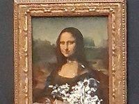 This Guy Dressed Up As An Old Lady, Rolled His Wheelchair Into The Louvre, And Threw A Cake At The Mona Lisa