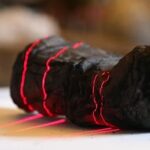 AI Has Helped Read The First Word Deciphered From Ancient Scrolls Carbonized By Mt. Vesuvius