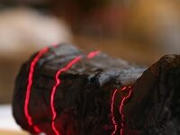 AI Has Helped Read The First Word Deciphered From Ancient Scrolls Carbonized By Mt. Vesuvius