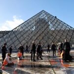 Climate-Protesting Art Vandals Attack Louvre’s Pyramid With Orange Paint