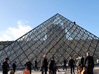 Climate-Protesting Art Vandals Attack Louvre’s Pyramid With Orange Paint