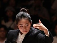 Conducting An Orchestra Made Up Entirely Of Traditional Chinese Instruments