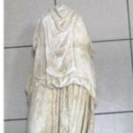 Man Discovers 2000-Year-Old Statue Near Some Garbage Cans