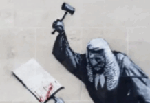 A New Banksy Mural Appears On The Royal Courts Of Justice Just After 900 Are Arrested At A Protest