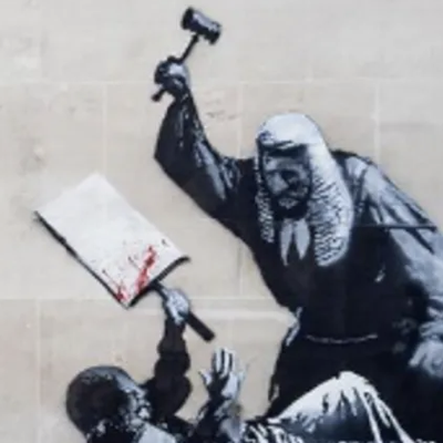 A New Banksy Mural Appears On The Royal Courts Of Justice Just After 900 Are Arrested At A Protest