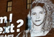 In Los Angeles, People Daringly Put Their Faces On Buildings Asking ICE If They’re Next