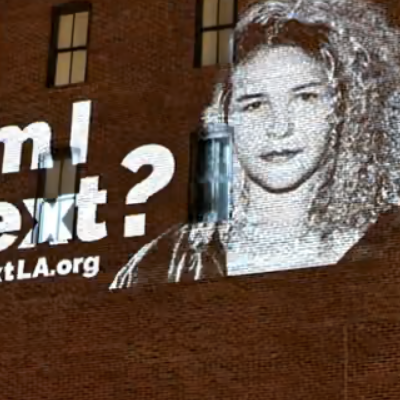 In Los Angeles, People Daringly Put Their Faces On Buildings Asking ICE If They’re Next