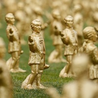 Salzburg Is Swarming With Little Golden Statues Of Mozart (And His Little Dog, Too)