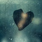 Heart drawn on a window with condensation