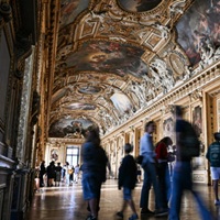 Two Men Arrested At Louvre — Not For Stealing Art, But For Putting It Up