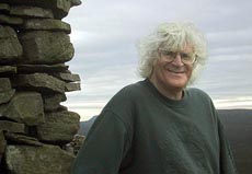 Greg Sandow by a cairn in England